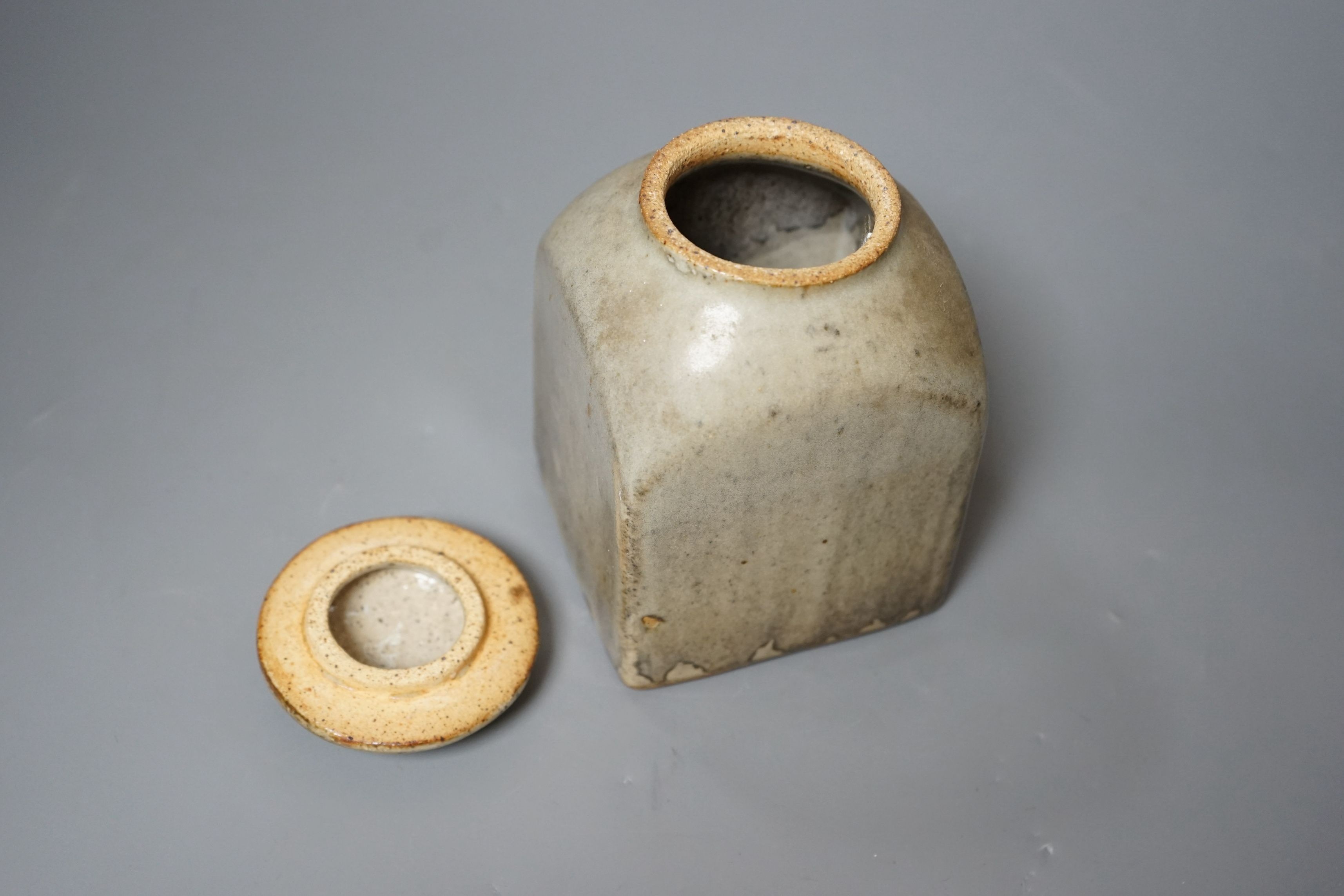 Bernard Leach for St Ives pottery, a mushroom-grey glazed square sided jar and cover, impressed marks to base, 16.5cm tall